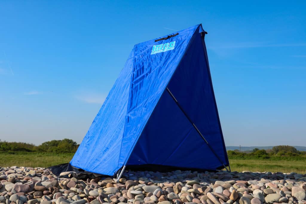 fishing tent on beach in sunshine